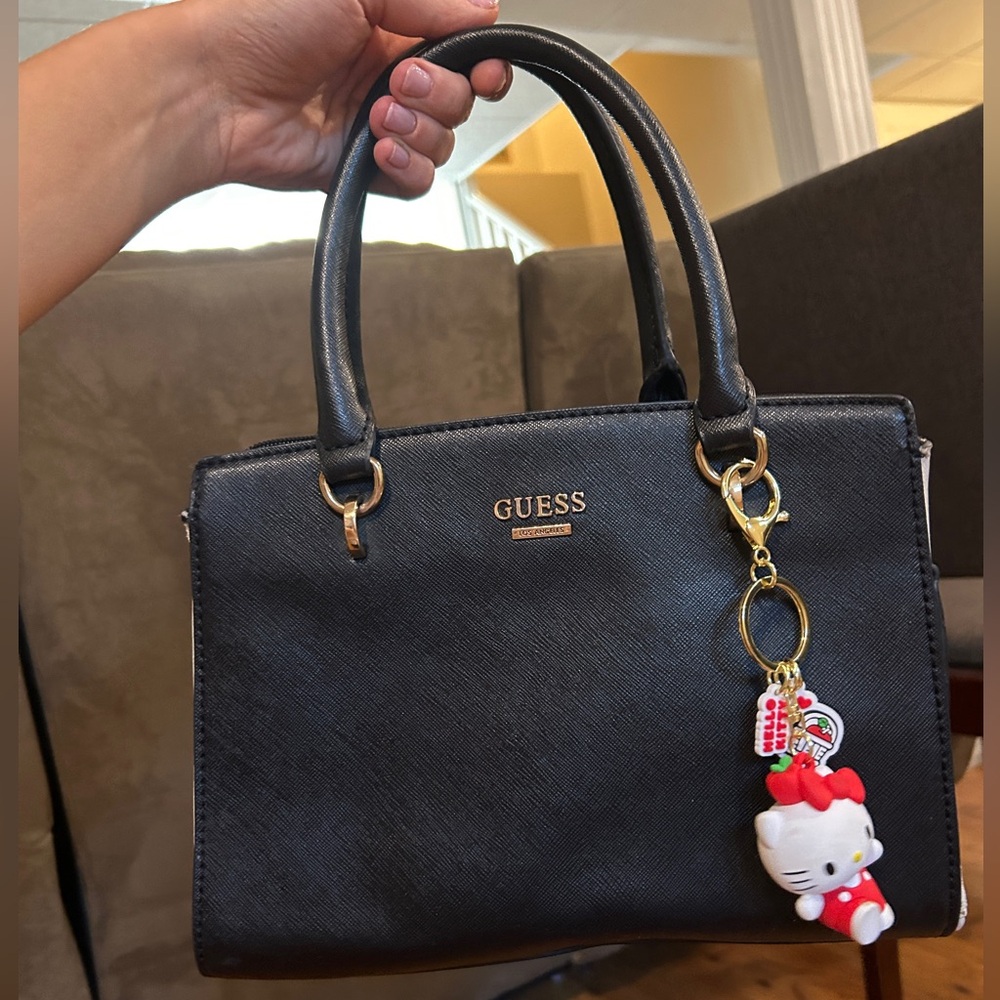 Amazing GUESS Black Handbag with Gold Hardware and white accent sidewalls